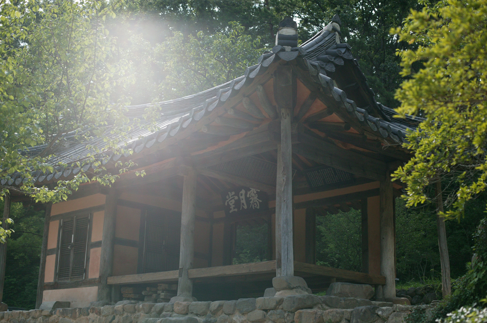 Jeongja pavilion “Jewoldang” in Soswaewon Garden with sunlight streaming through the trees