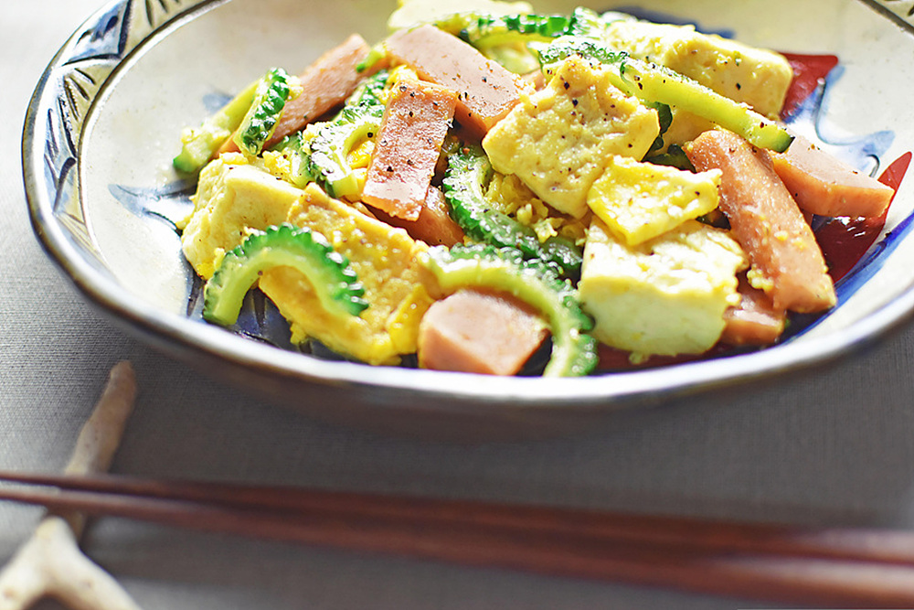 A close-up of Goya Champuru, a traditional Okinawan stir-fry made with bitter melon, tofu, egg, and pork. 